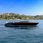Riva Aquariva cruising on Lake Garda during an exclusive private charter experience
