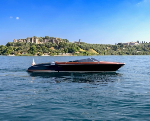 Riva Aquariva cruising on Lake Garda during an exclusive private charter experience