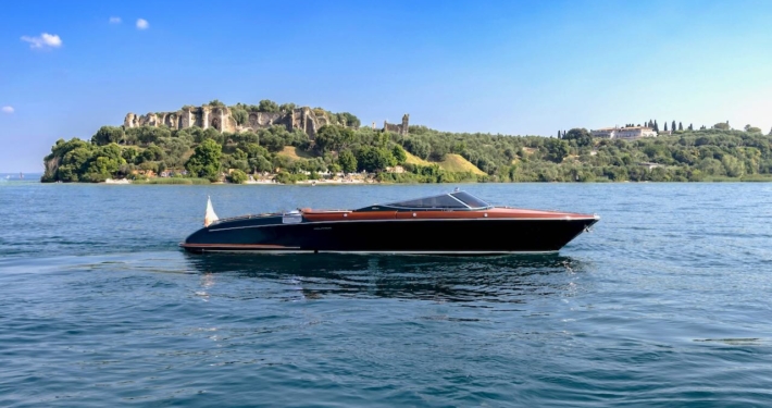 Riva Aquariva cruising on Lake Garda during an exclusive private charter experience