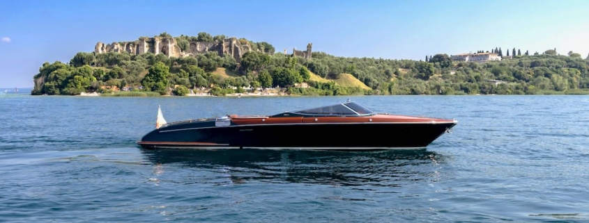 Riva Aquariva cruising on Lake Garda during an exclusive private charter experience